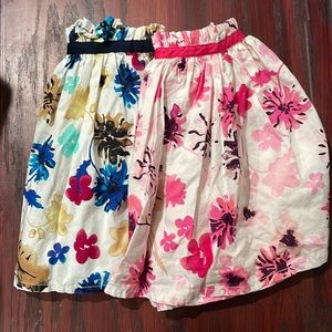 OshKosh. Two skirts with built in shorts. Both size 6
